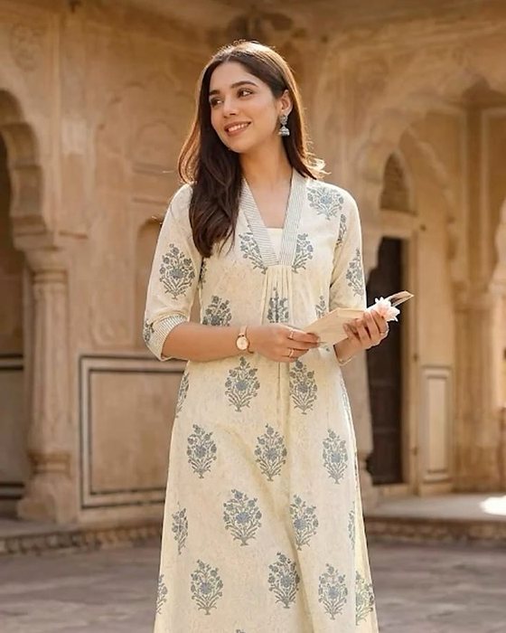 A cream printed cotton kurta worn casually